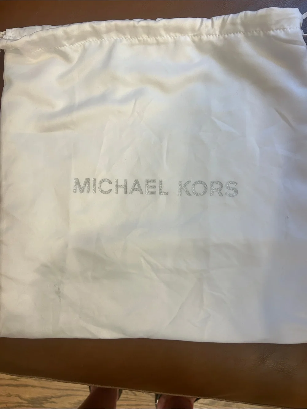 New with tags  Michael Kors Metallic Gold Textured Small Mercer